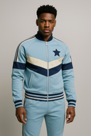 Celestial Monarch sky blue and navy tracksuit in StarFlex fabric, designer luxury cosmic wear with chevron panels and navy star emblem