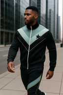 Charcoal Luxe black, sage and gold tracksuit featuring sophisticated chevron panels and gold piping details, representing luxury urban athletic wear