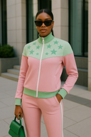 Stardust Royalty pink and green tracksuit in StarFlex fabric, designer luxury cosmic wear with multiple star emblems and color-block design