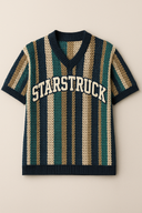 Classic striped designer sweater vest in navy, green, cream, and gold vertical stripes with white STARSTRUCK chest branding, featuring premium StarFlex knitwear construction and vintage academic styling
